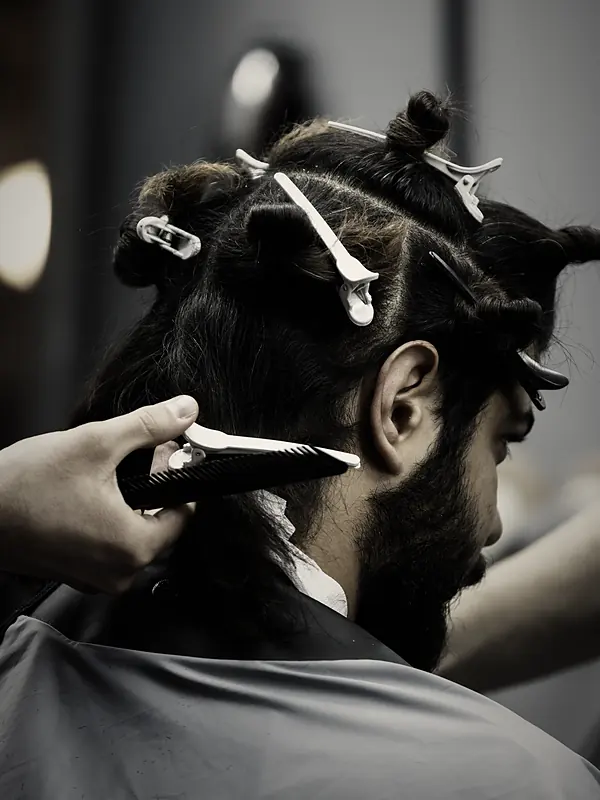 Mirror check at the end of a cut at The Barbershop