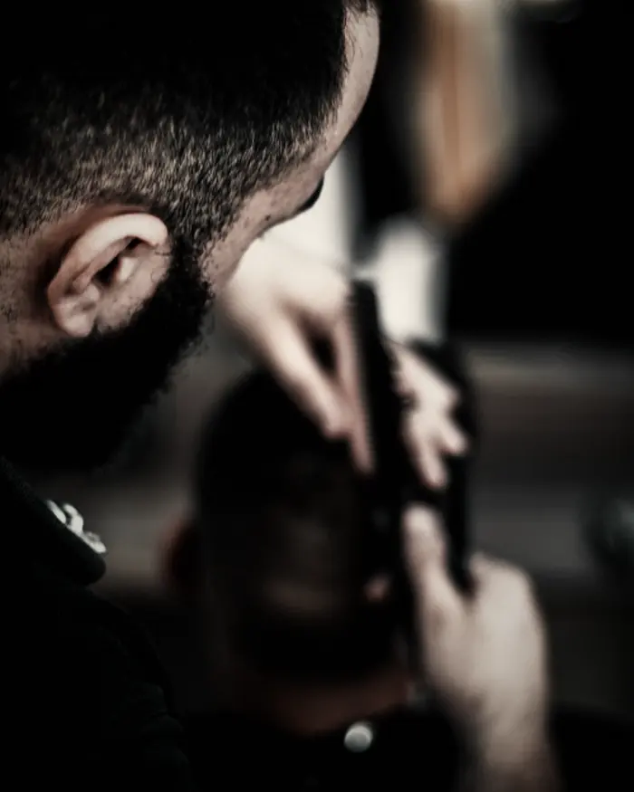 Barber at work at The Barbershop in Ridgeway, New Jersey